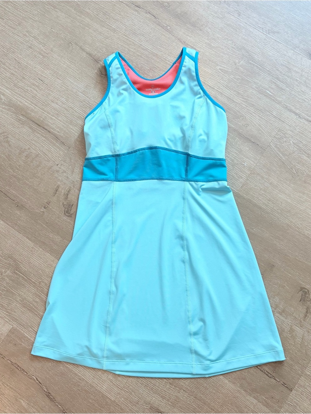 Moving Comfort athletic dress features a light blue orange inner lining Sz M